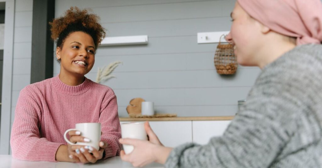 Two women sharing coffee and using easy conversation starters