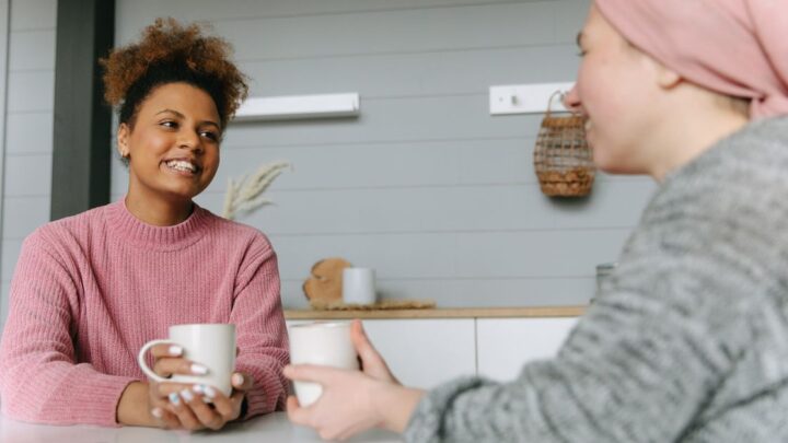 Two women sharing coffee and using easy conversation starters