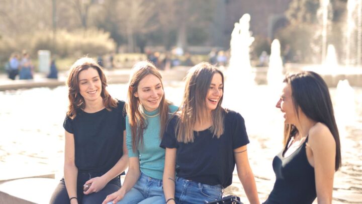 Group of friends laughing together while answering ice breaker questions